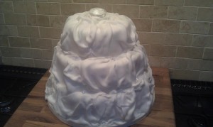 Alaska 3 Tier Cake with icing draped like material and small crystals